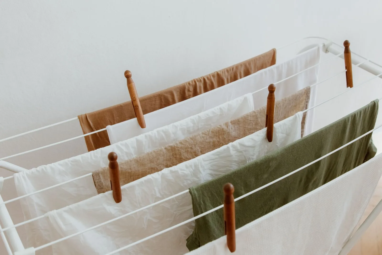 Clean laundry drying on an indoor clothes drying rack
